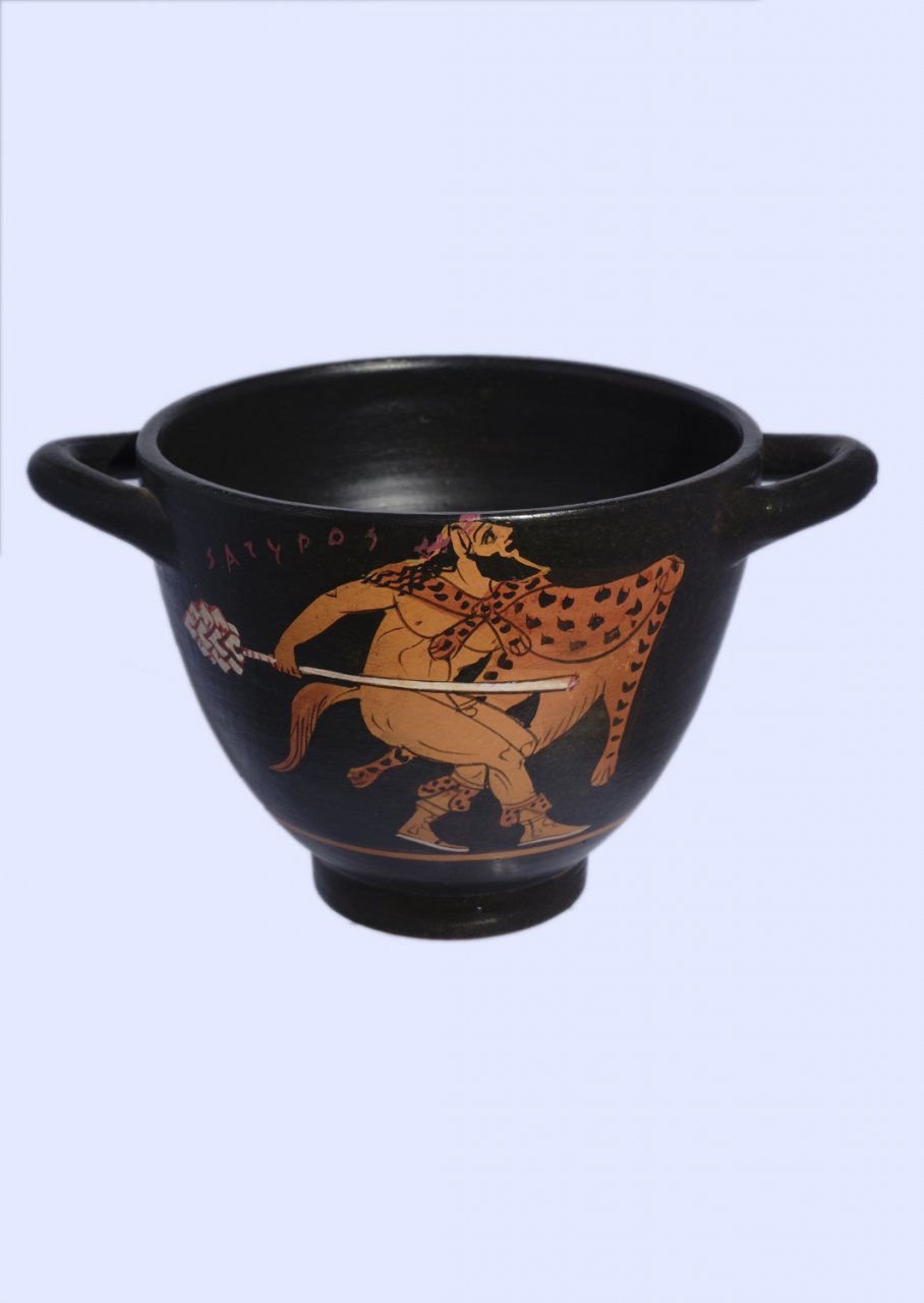 Classical Red-figure skyphos depicting a Satyr and a Muse